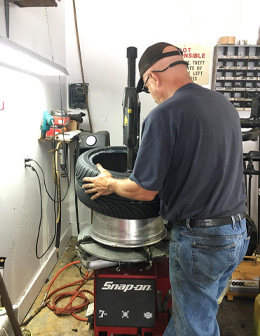 Mechanic Working On Transmission